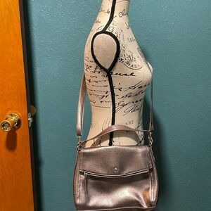 Light copper colored crossbody w/adjustable removable strap to use as a clutch.